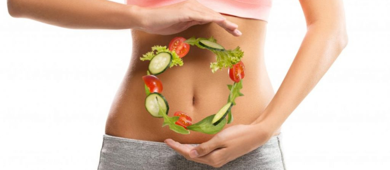 woman-with-vegetables-hovering-in-front-of-her-belly-1024×683